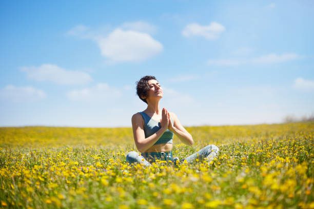 A person meditating in a natural setting